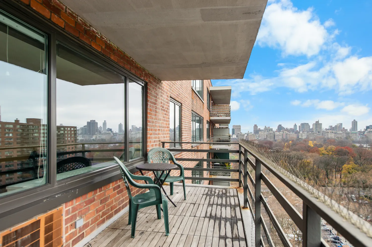 a view of a balcony with wooden floor and lake view