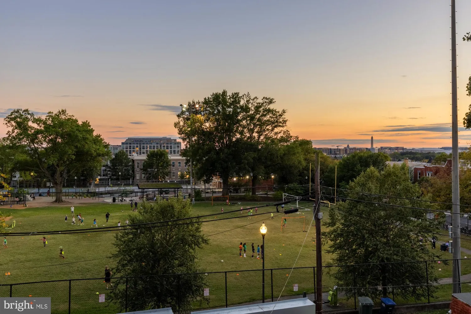 a view of a swimming pool with an outdoor seating and a yard