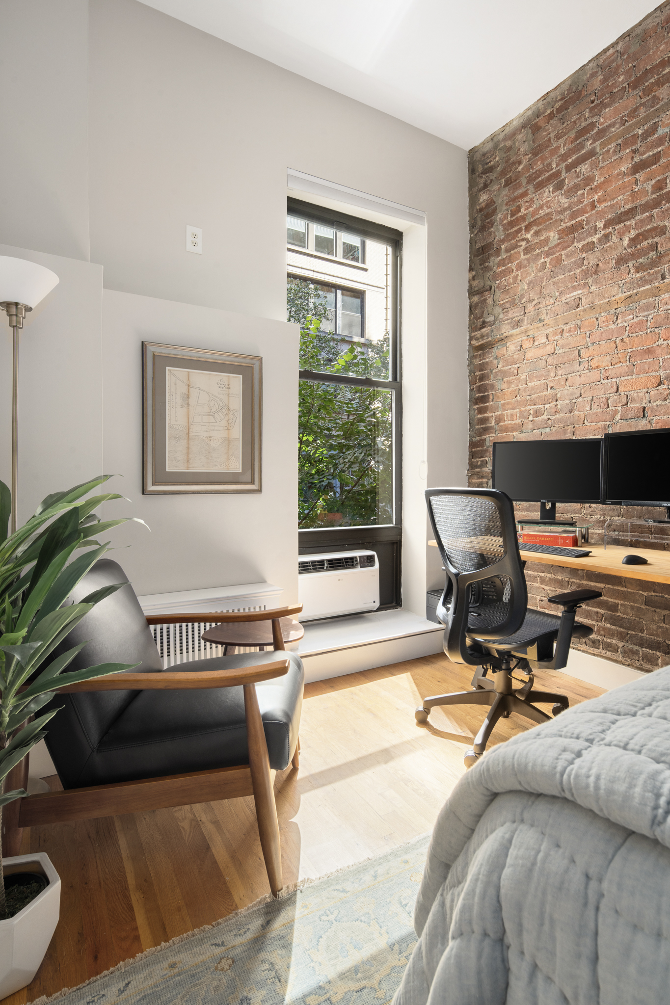 23 East 10th Street, Unit 3C Manhattan, NY 10003 - Photo 8 of 15 a living room with furniture and a window