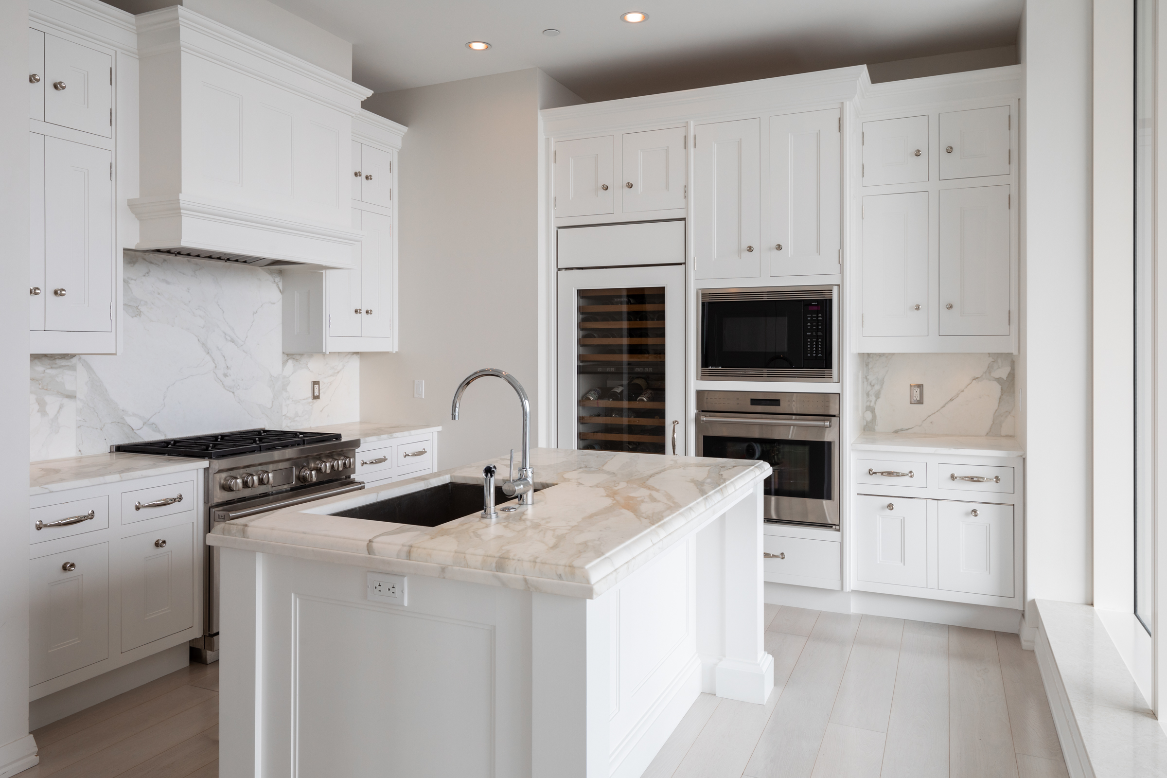 1 Franklin Street, Unit PH2D Boston, MA 02110 - Photo 12 of 26 a kitchen with stainless steel appliances granite countertop a stove a sink and a refrigerator