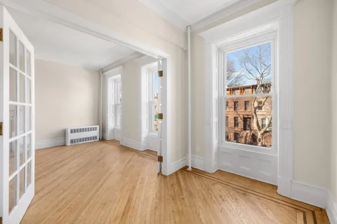a view of an empty room with a window