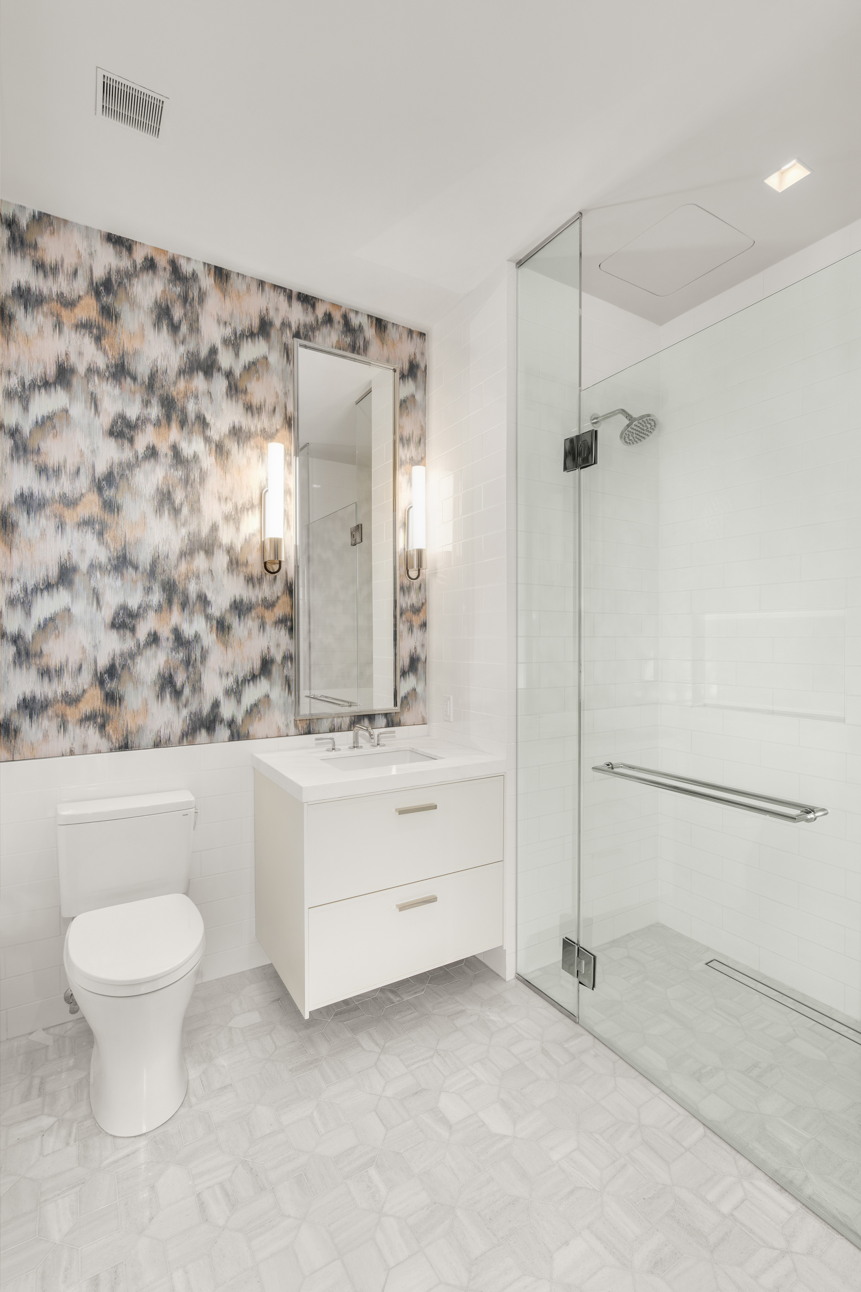 200 East 83rd Street, Unit 24C Manhattan, NY 10028 - Photo 17 of 35 a bathroom with a sink and a mirror