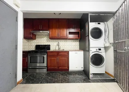 a kitchen with a stove and a sink