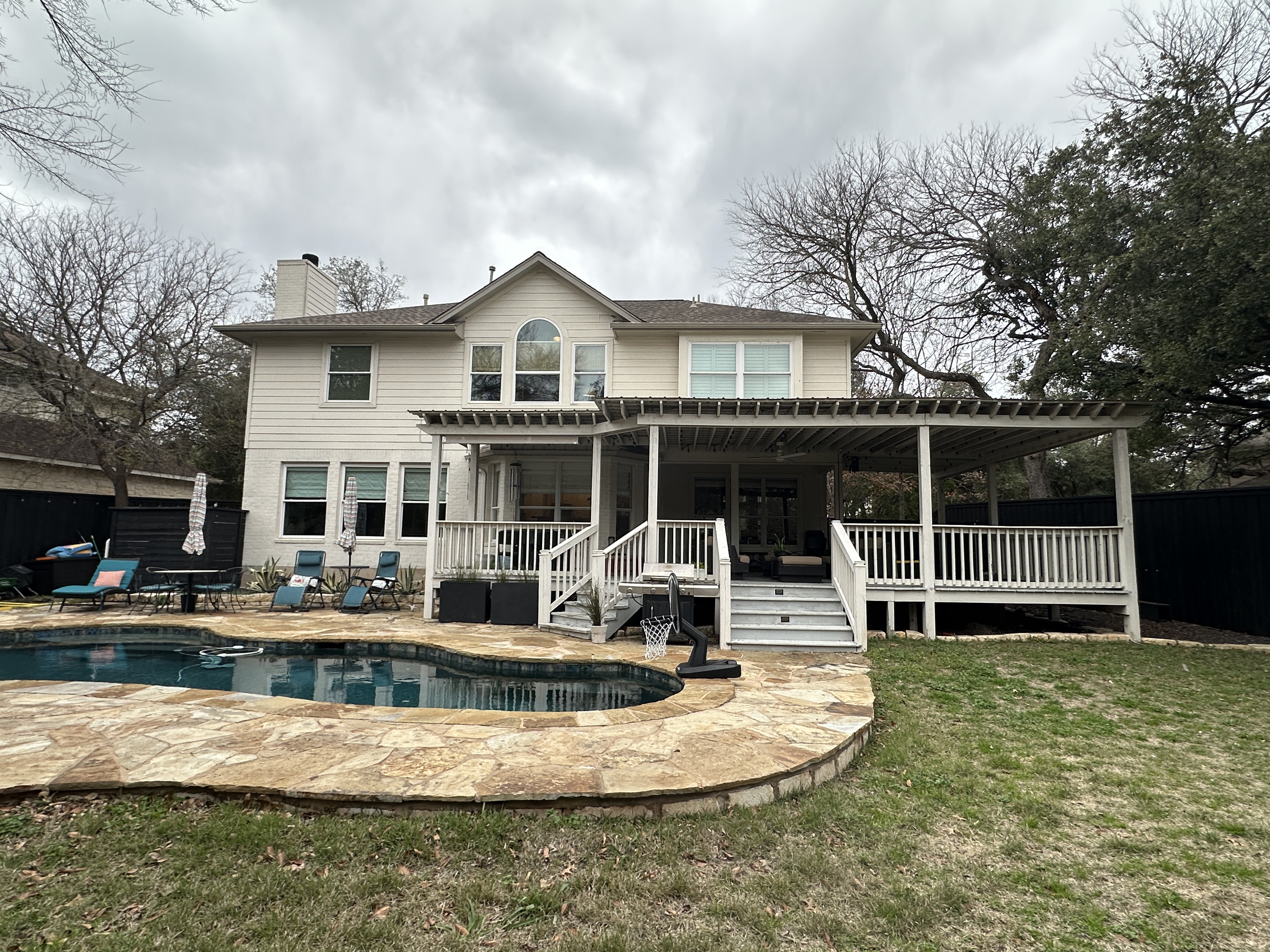 11105 Bexley Lane Austin, TX 78739 - Photo 11 of 12 a front view of a house with a yard table and chairs