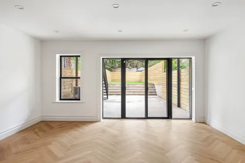 a view of an empty room with a window