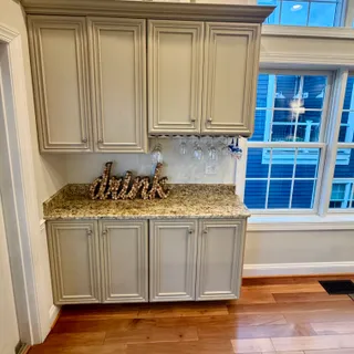 a kitchen with granite countertop wooden cabinets and a granite counter tops
