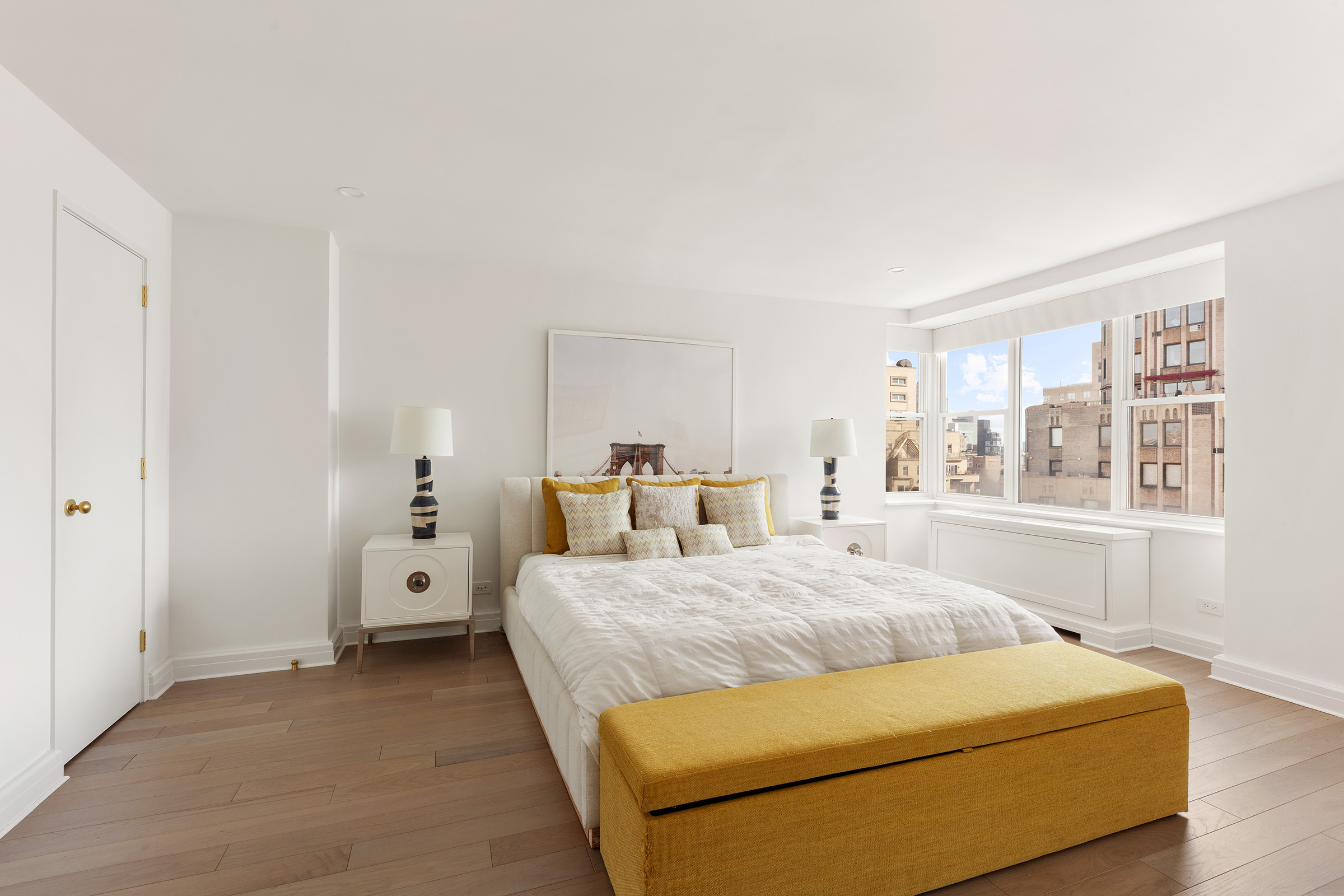 2 5th Avenue, Unit PHC Manhattan, NY 10011 - Photo 7 of 13 a bedroom with a bed and large windows