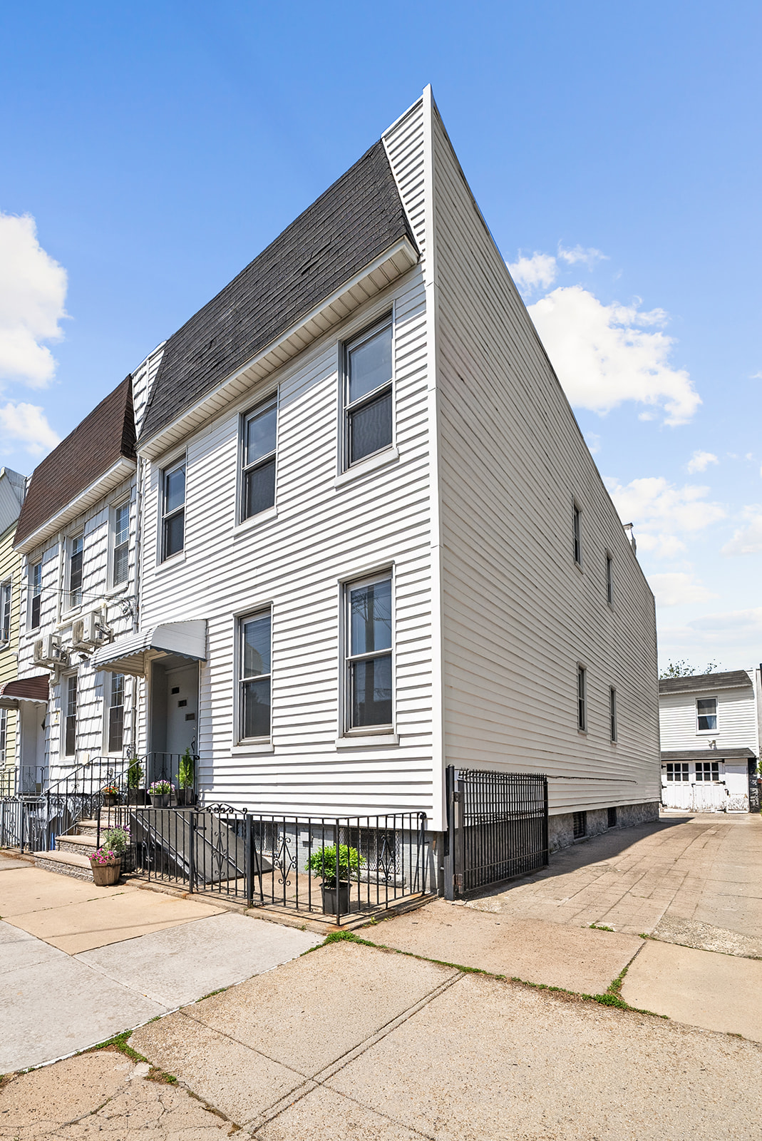 59-45 Palmetto Street Queens, NY 11385 - Photo 20 of 25 a front view of a house with a outdoor