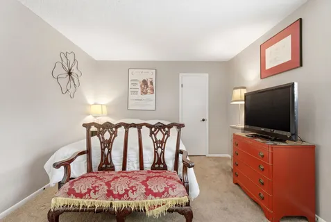 a bedroom with a bed and a table in it