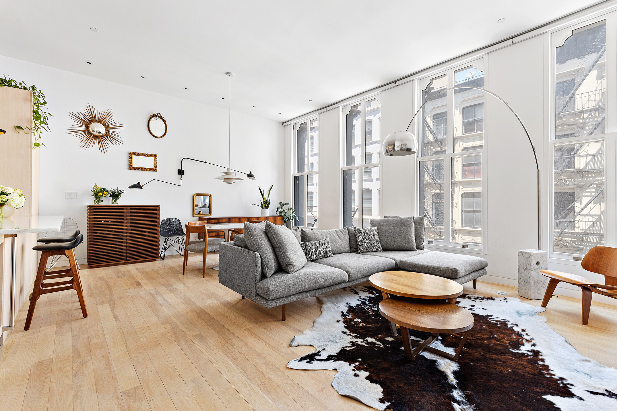 93 Reade Street, Unit 3 Manhattan, NY 10013 - Photo 1 of 12 a living room with furniture a rug and a large window