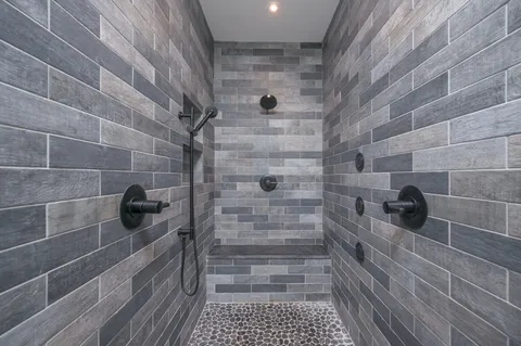 a bathroom with a double vanity sink and a mirror