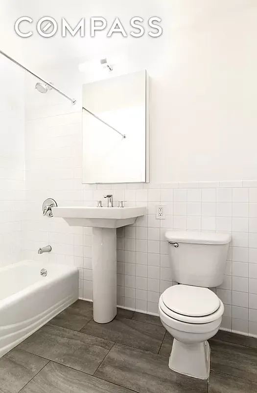 204 Huntington Street, Unit 2I Brooklyn, NY 11231 - Photo 4 of 7 a bathroom with a toilet sink and mirror