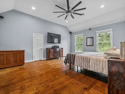 a bed room with a bed and a television