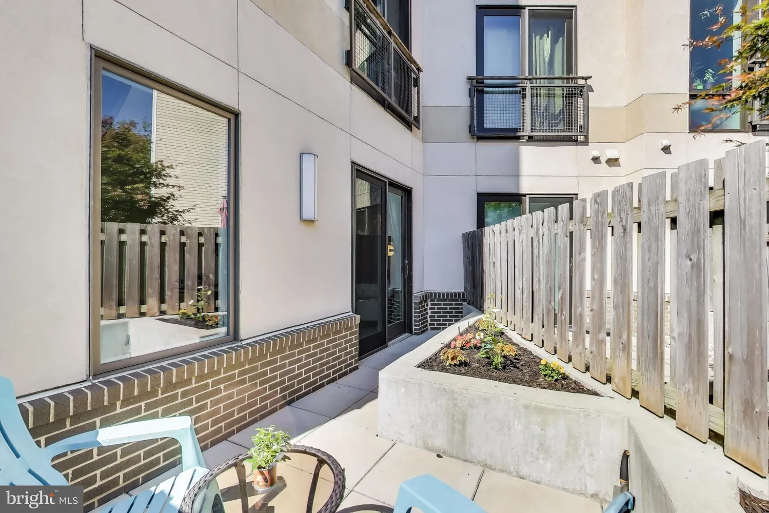 a view of a balcony with furniture