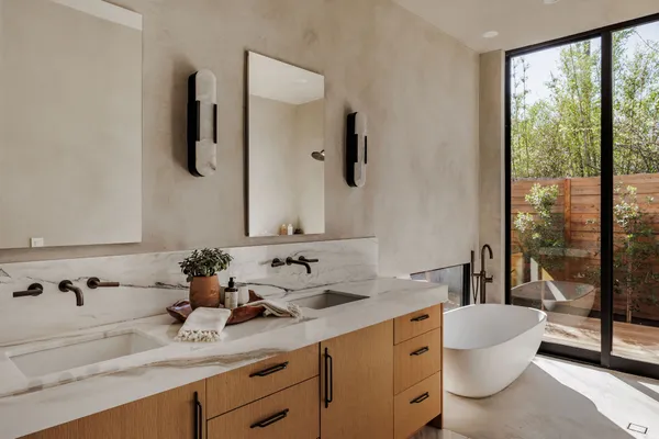 a bathroom with a sink and mirror