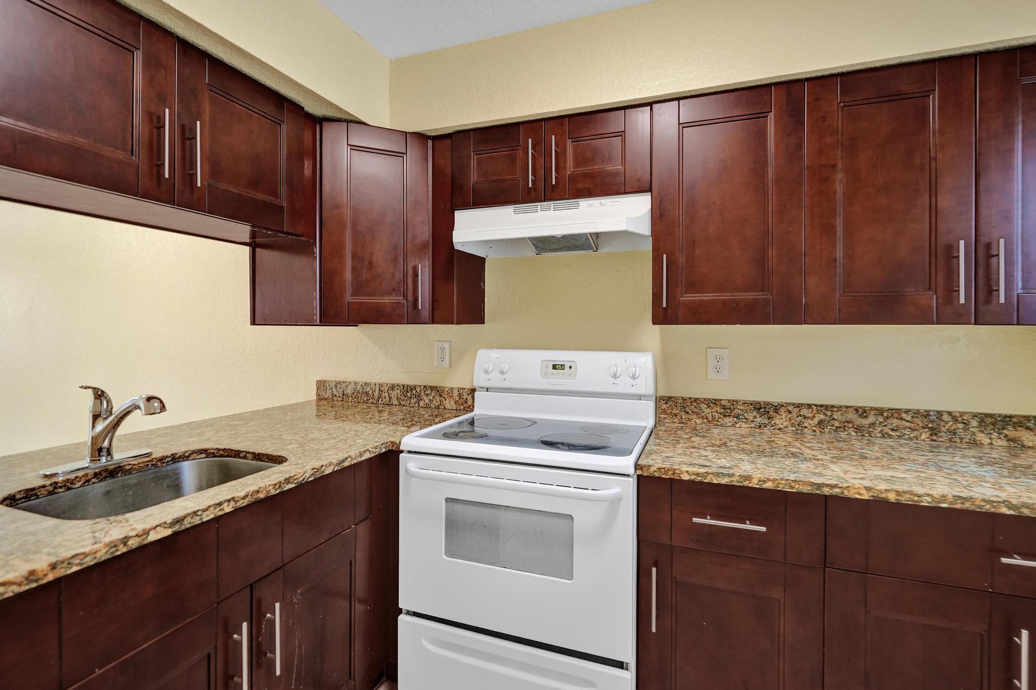 1101 Prospect Road Fort Lauderdale, FL 33309 - Photo 30 of 34 a kitchen with sink cabinets and window