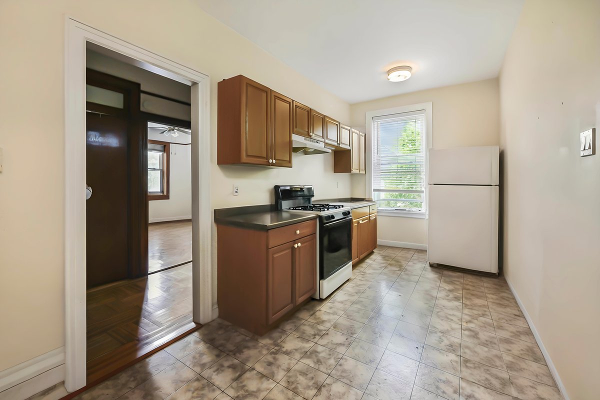 1702 11th Avenue Brooklyn, NY 11218 - Photo 15 of 25 a kitchen with stainless steel appliances granite countertop a refrigerator stove and sink