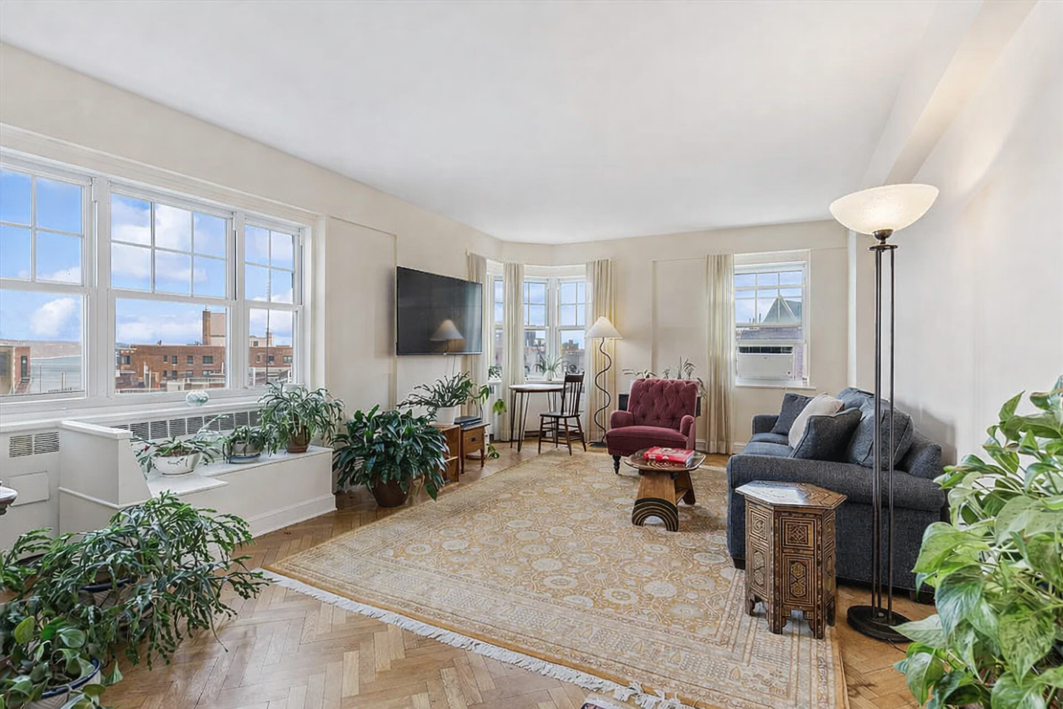 a living room with furniture and a flat screen tv