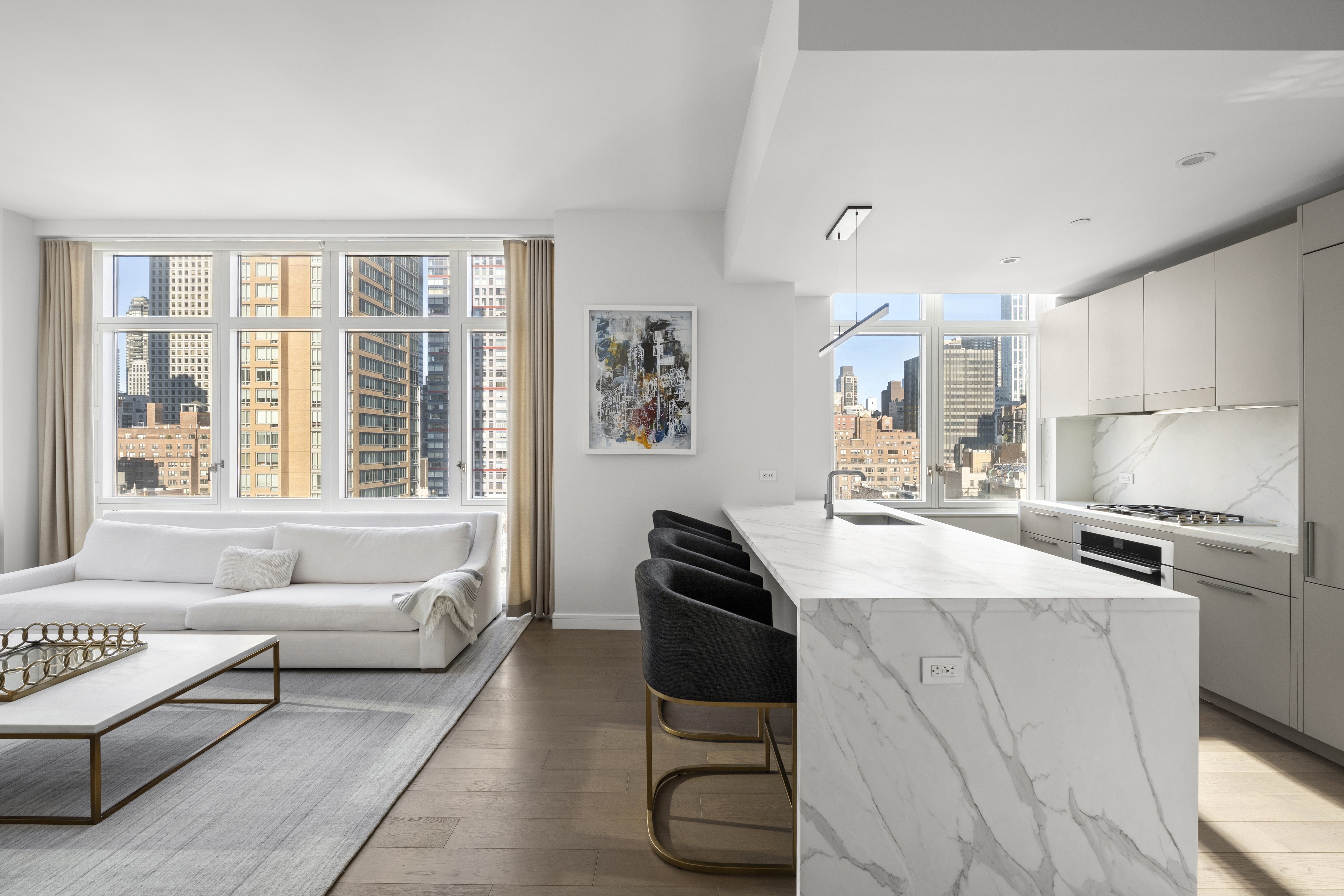 305 East 51st Street, Unit 11D Manhattan, NY 10022 - Photo 5 of 18 a living room with furniture and a large window