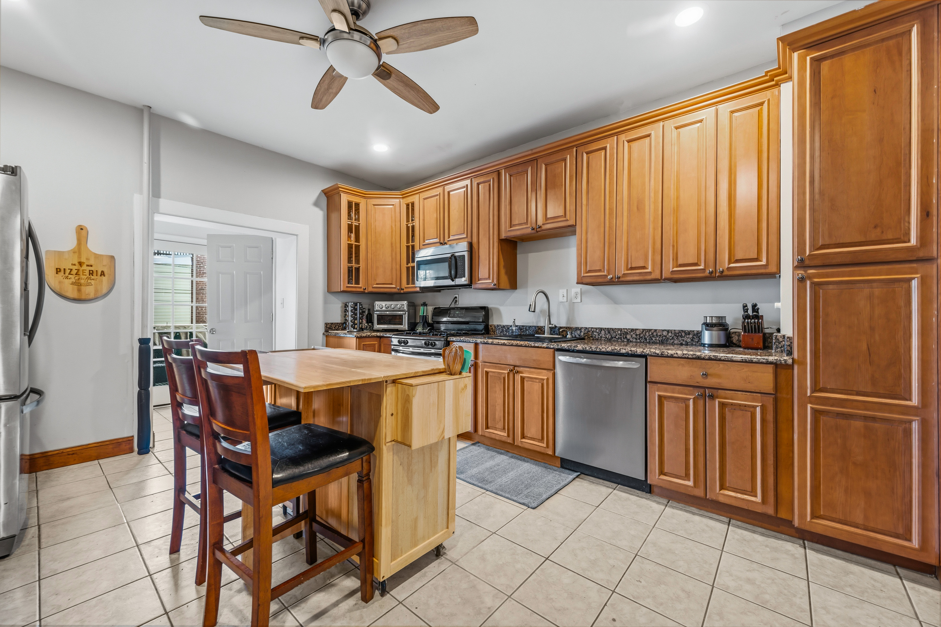 633 South Conkling Street Baltimore, MD 21224 - Photo 9 of 23 a kitchen with stainless steel appliances granite countertop a stove a sink dishwasher and a refrigerator