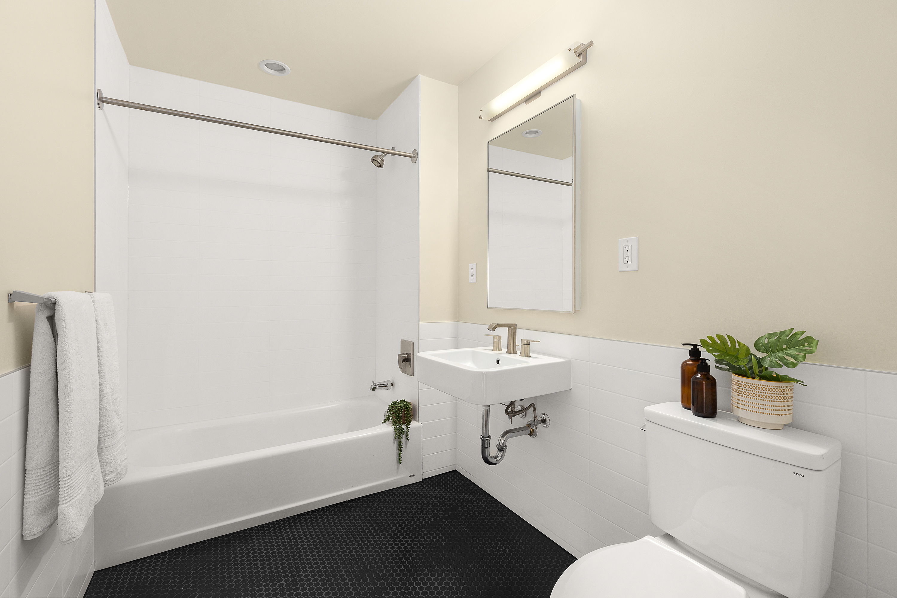 318 Knickerbocker Avenue, Unit 3D Brooklyn, NY 11237 - Photo 5 of 14 a bathroom with a sink toilet and shower