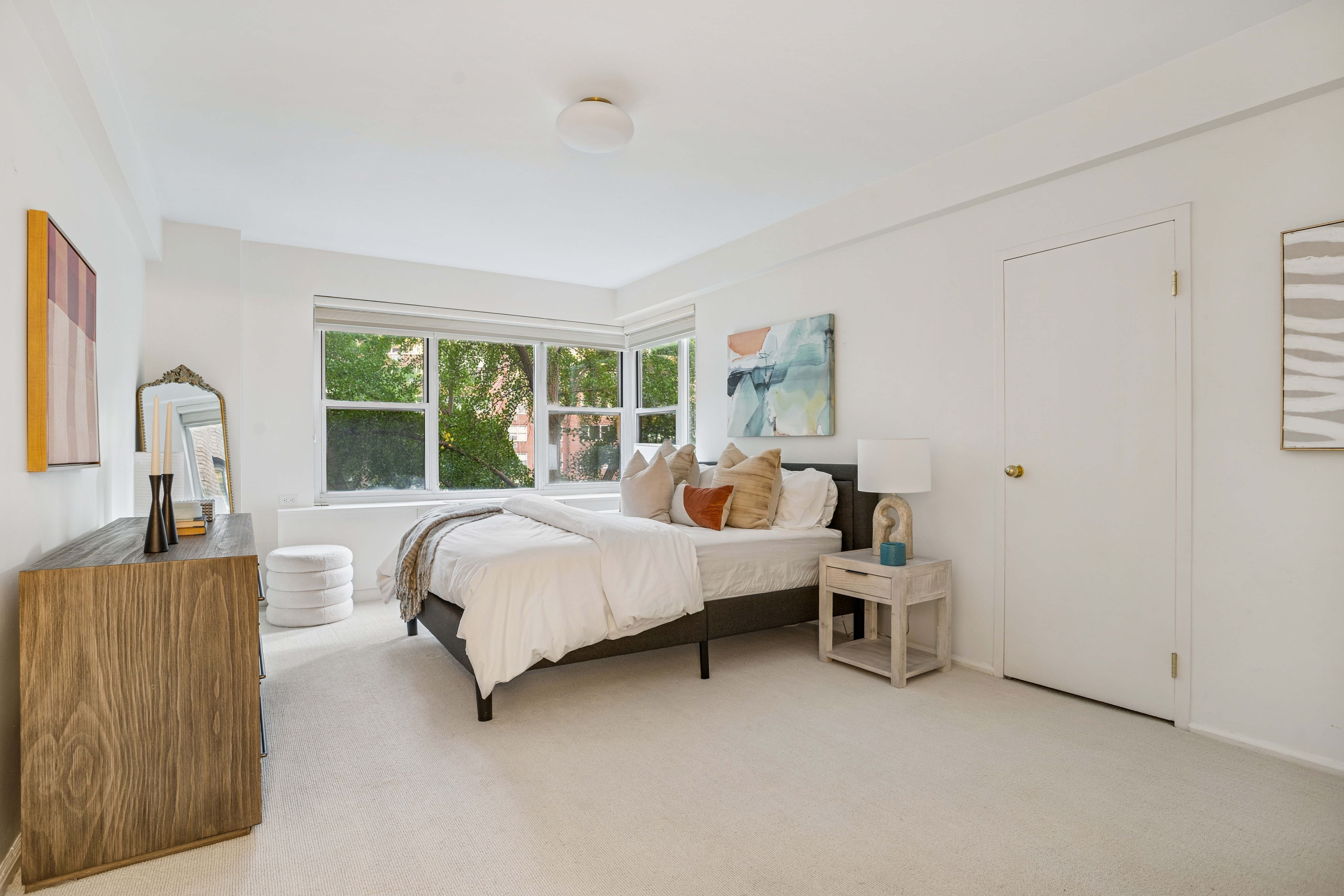 440 East 56th Street, Unit 6FGH Manhattan, NY 10022 - Photo 12 of 18 a bed room with a bed and a window