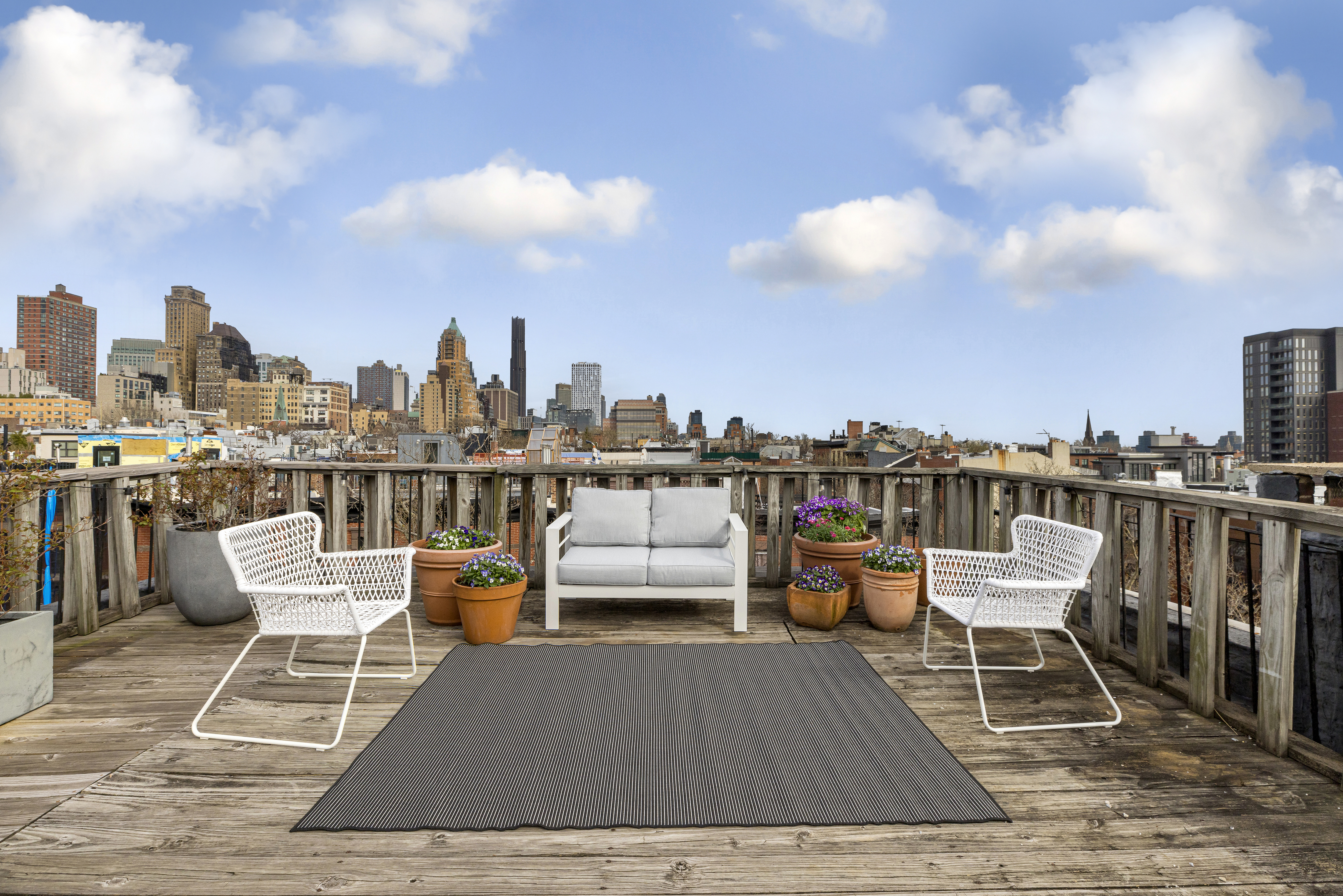 312 Hicks Street, Unit 4 Brooklyn, NY 11201 - Photo 9 of 13 a chairs on a deck with a kitchen