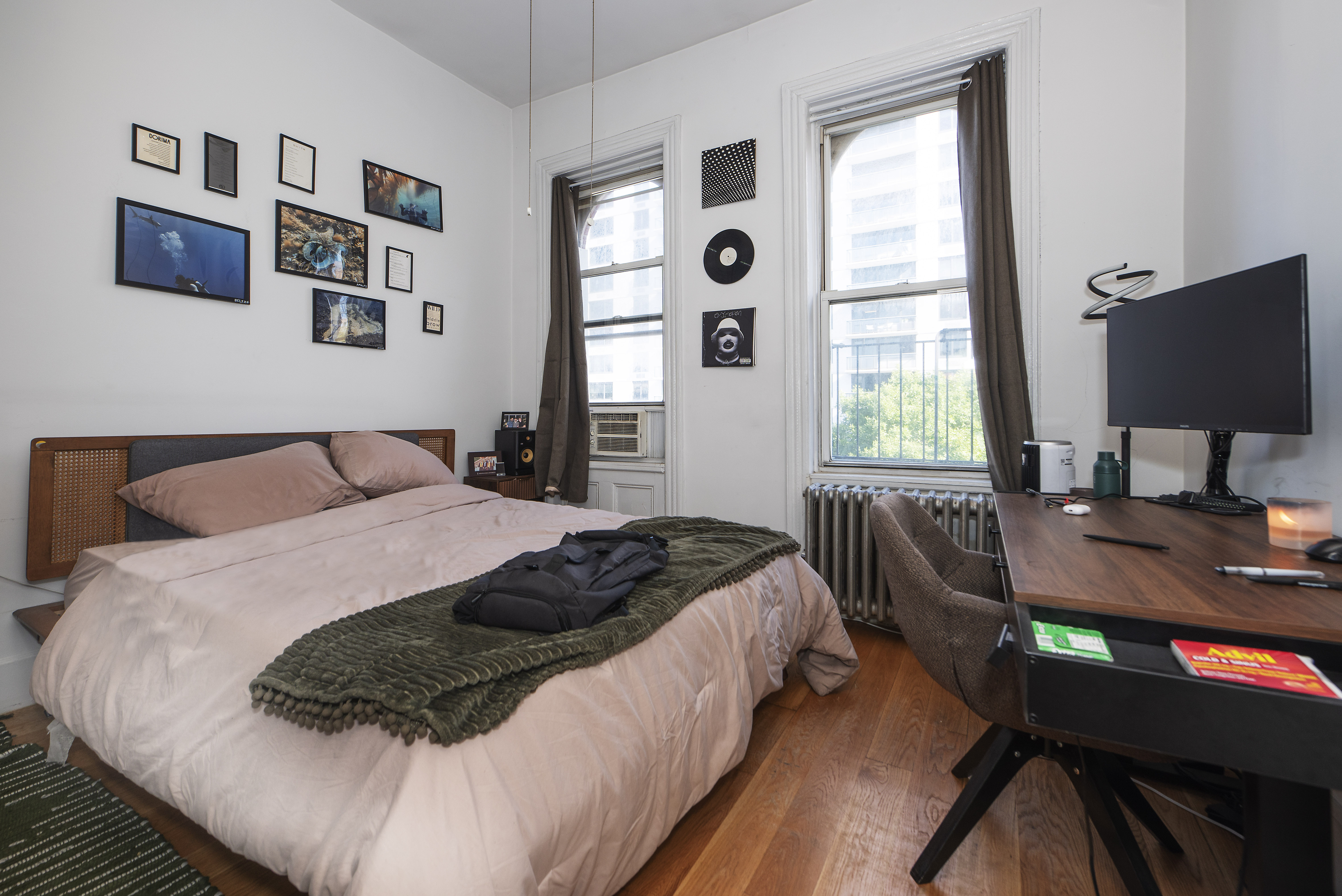 249 East Houston Street, Unit 4 Manhattan, NY 10002 - Photo 5 of 10 a bedroom with a bed window and a desk