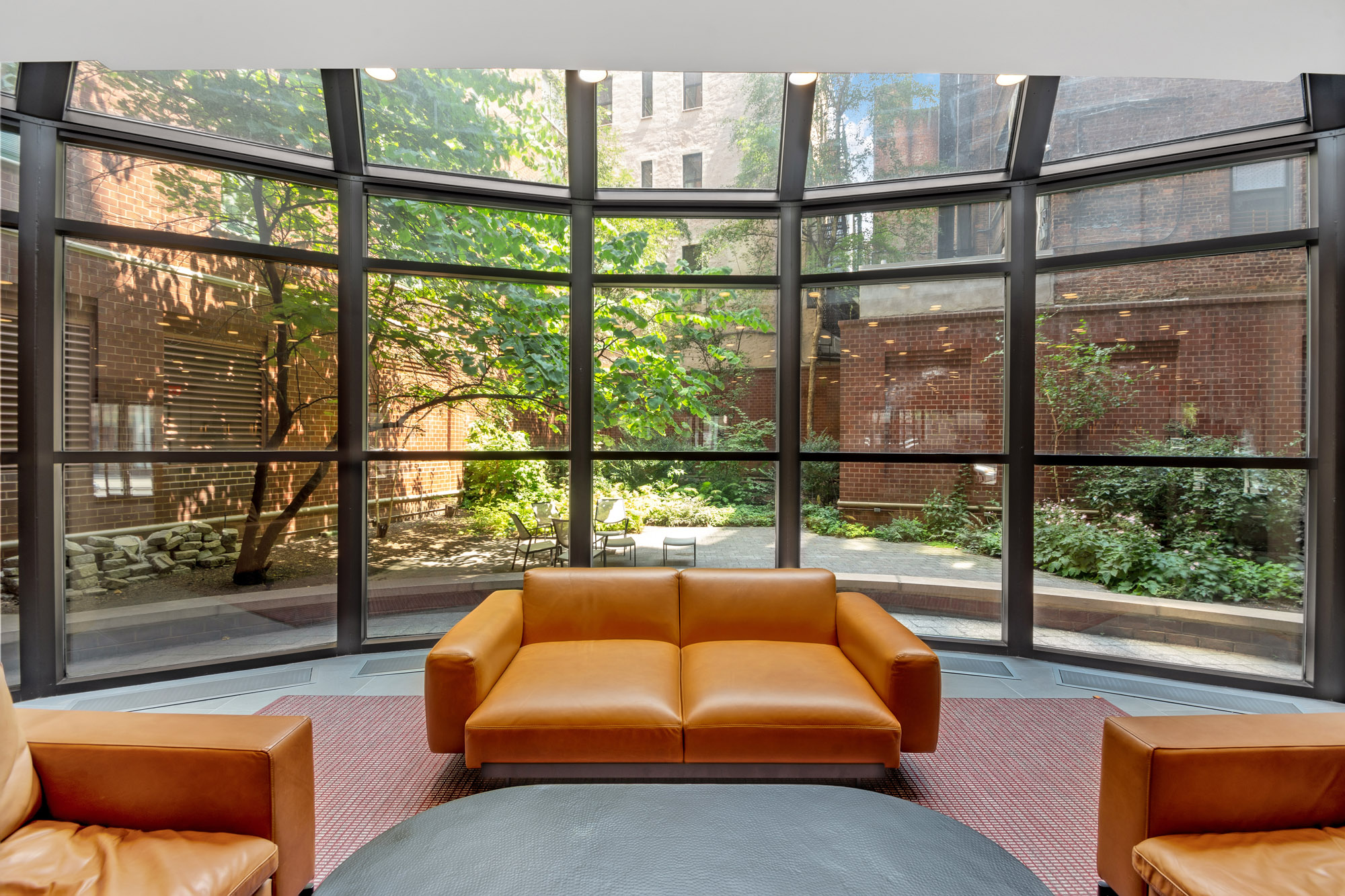 275 Greenwich Street, Unit 11J Manhattan, NY 10007 - Photo 8 of 9 a living room with furniture and a window