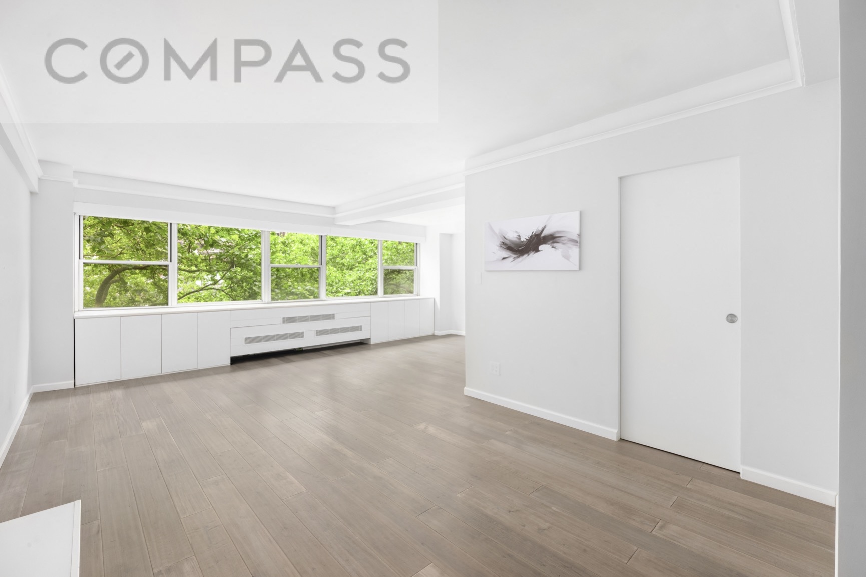 a view of an empty room with a window