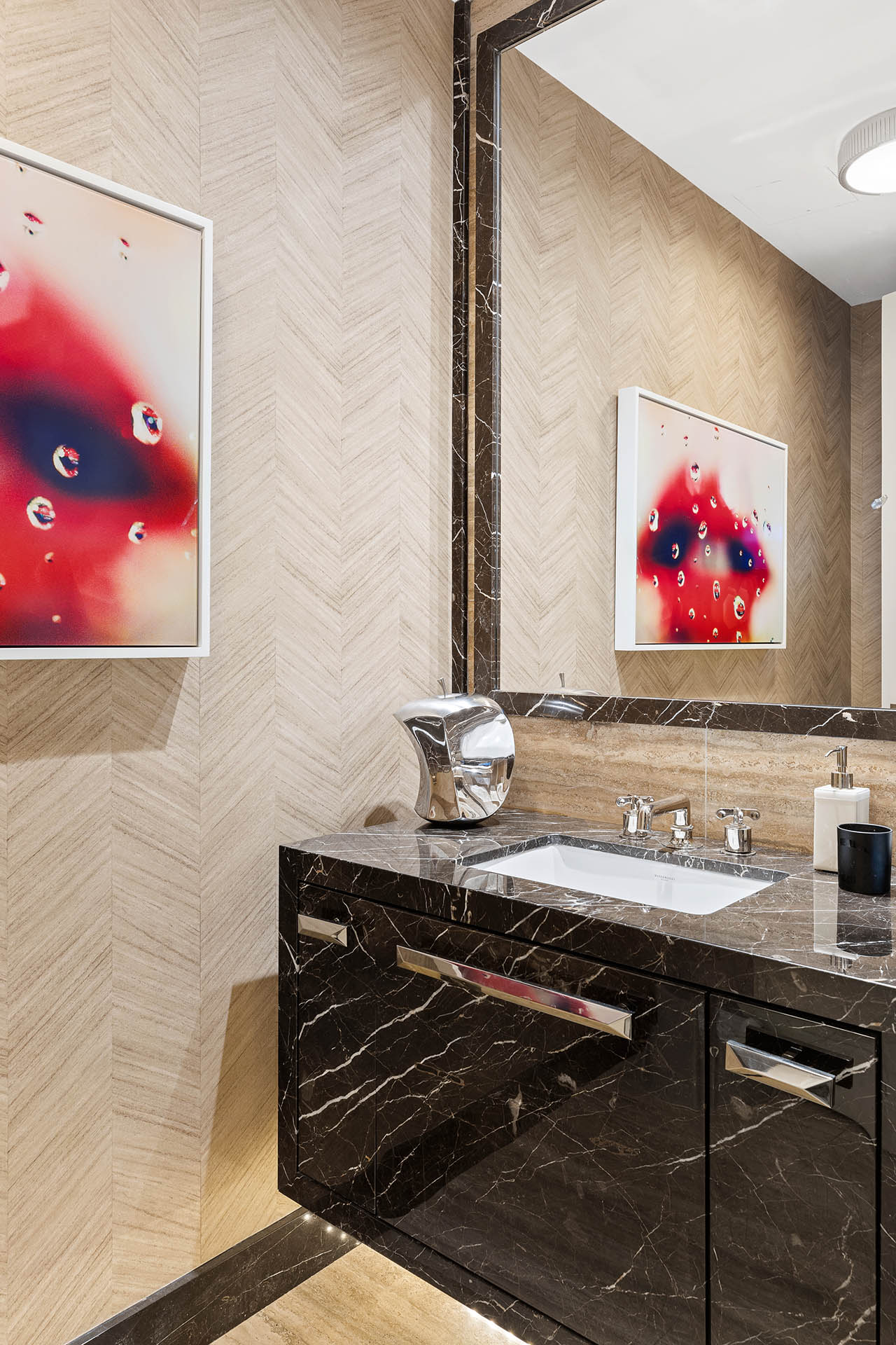 212 5th Avenue, Unit 9B Manhattan, NY 10010 - Photo 13 of 16 a bathroom with a sink and a mirror
