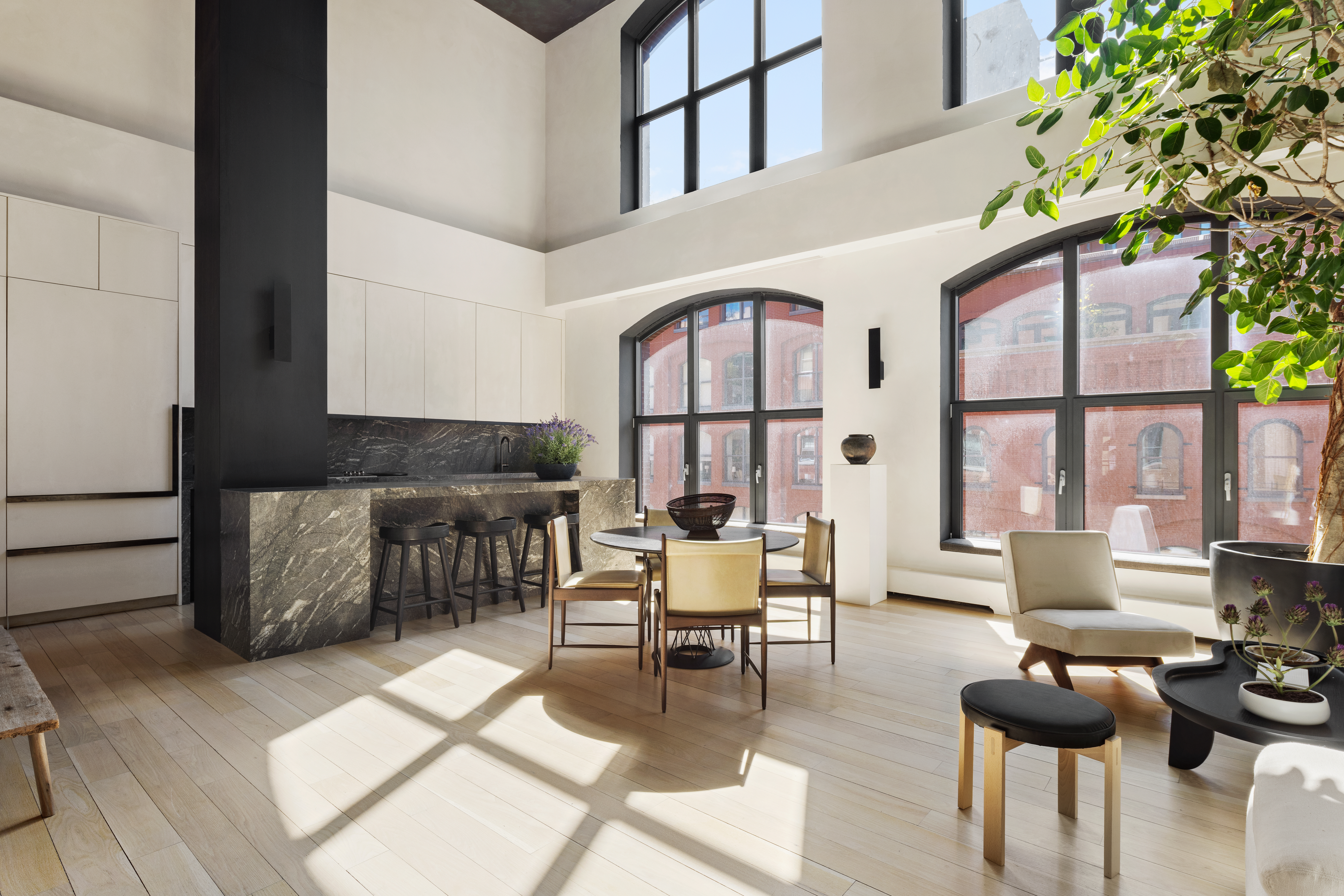 415 Washington Street, Unit 5A Manhattan, NY 10013 - Photo 2 of 22 a living room with furniture and a floor to ceiling window