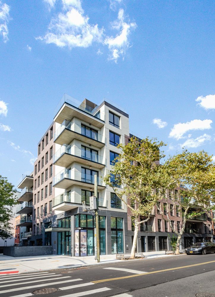 435 Tompkins Avenue, Unit PH505 Brooklyn, NY 11216 - Photo 13 of 14 a view of a building with a street