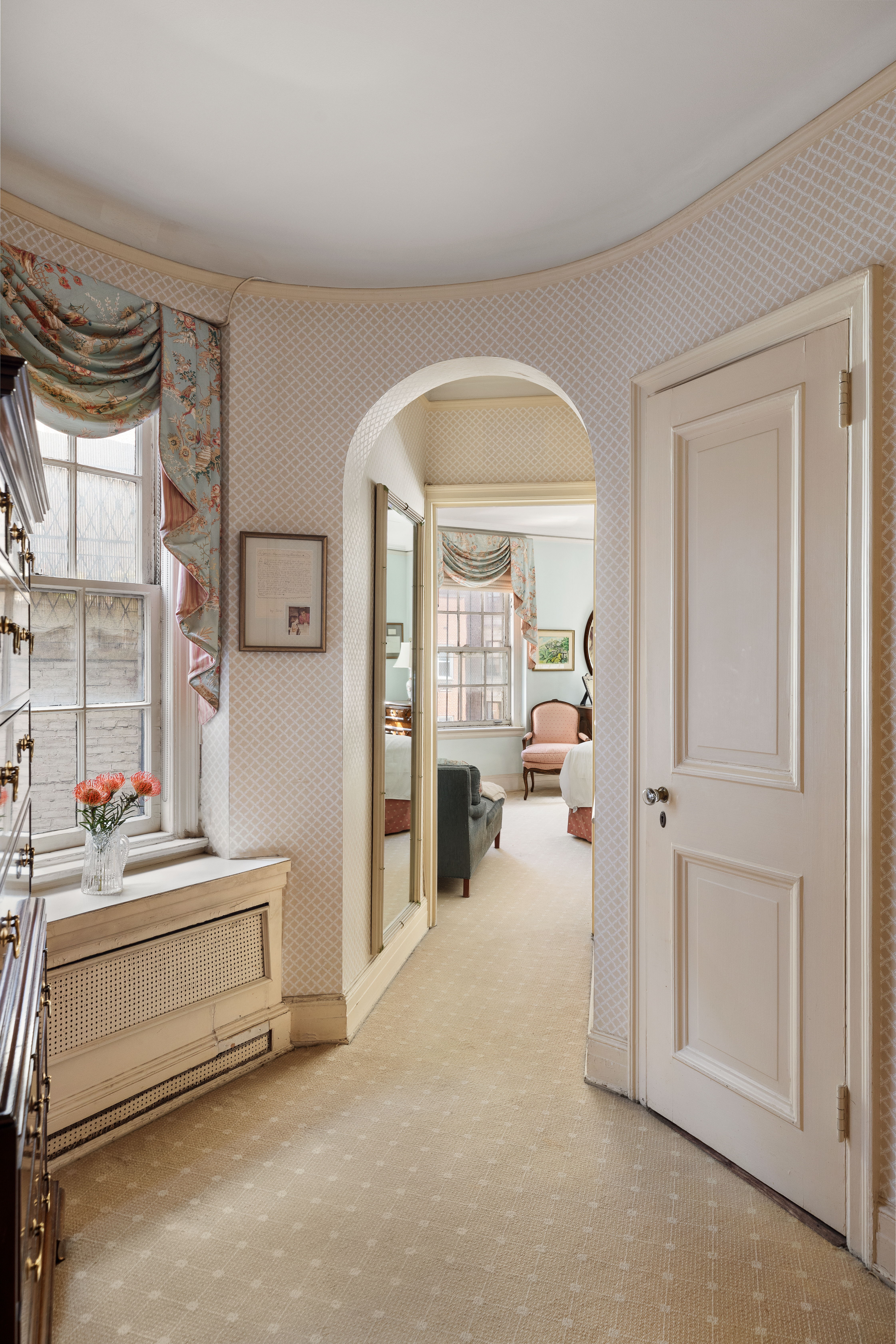 136 East 79th Street, Unit 4B Manhattan, NY 10075 - Photo 6 of 14 a view of a livingroom with furniture and windows