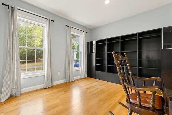 a bedroom with furniture and a window