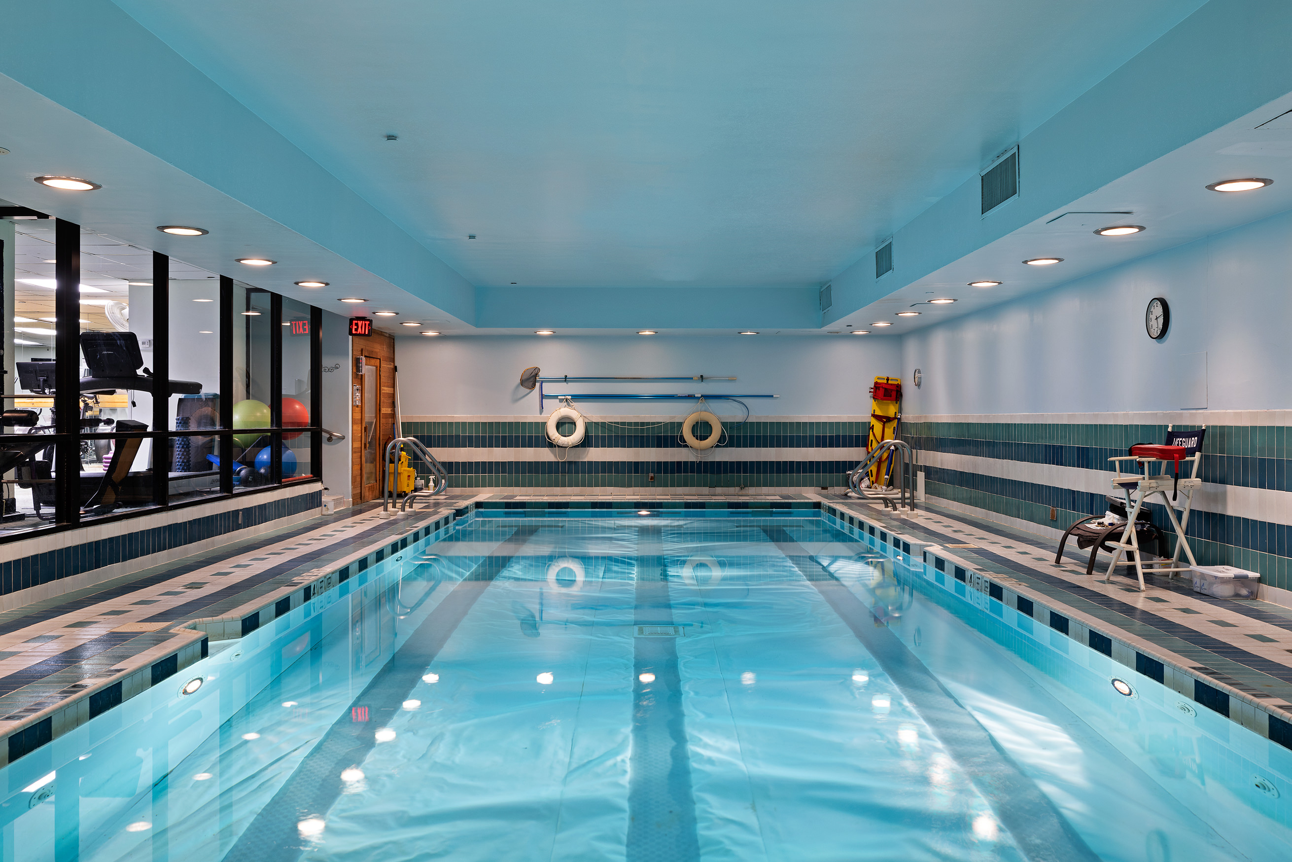 304 East 65th Street, Unit 10D Manhattan, NY 10065 - Photo 12 of 14 a large swimming pool with lots of lights