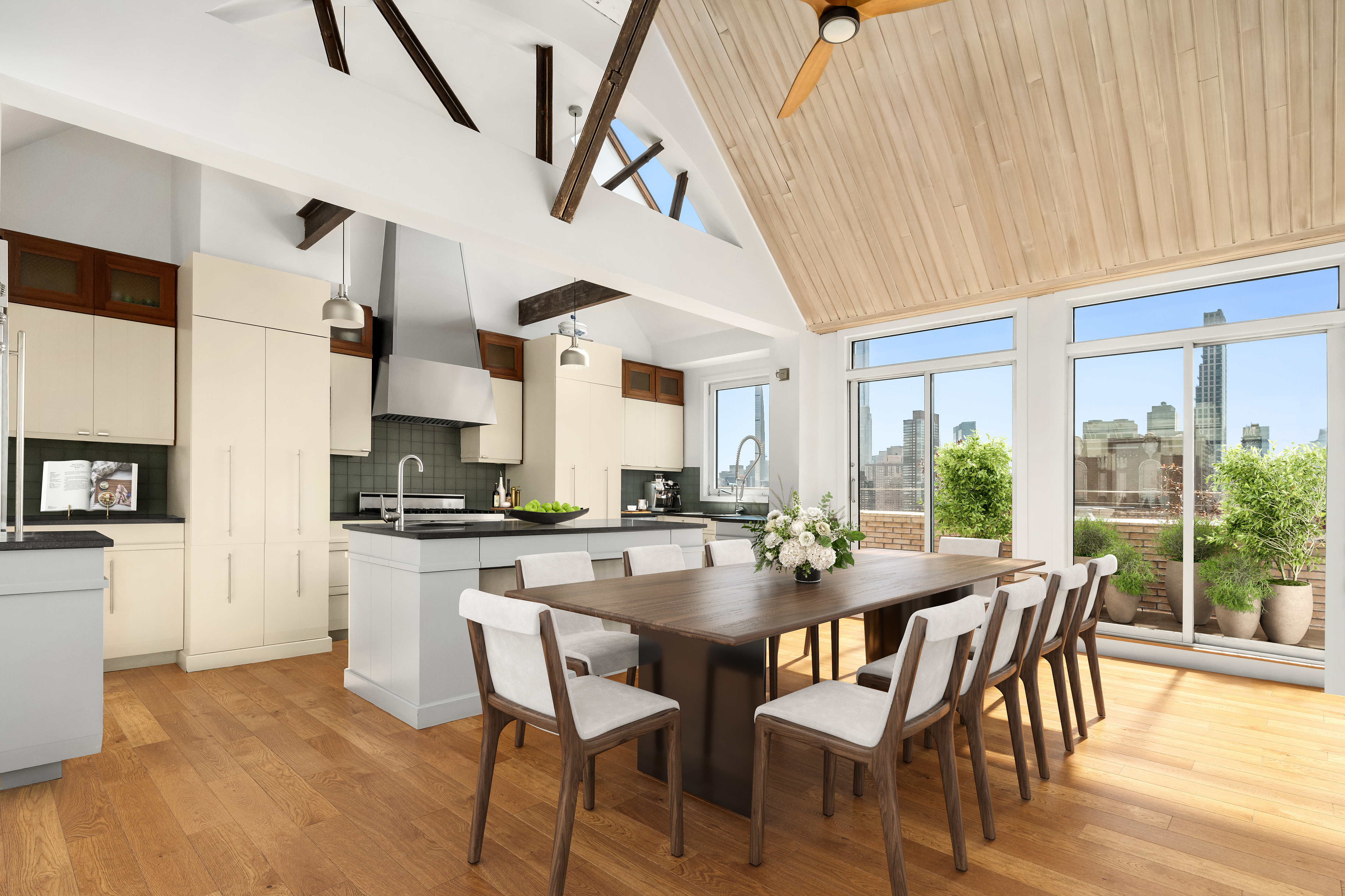 2166 Broadway, Unit PH Manhattan, NY 10024 - Photo 5 of 37 a dining room with stainless steel appliances kitchen island granite countertop a table chairs and a refrigerator
