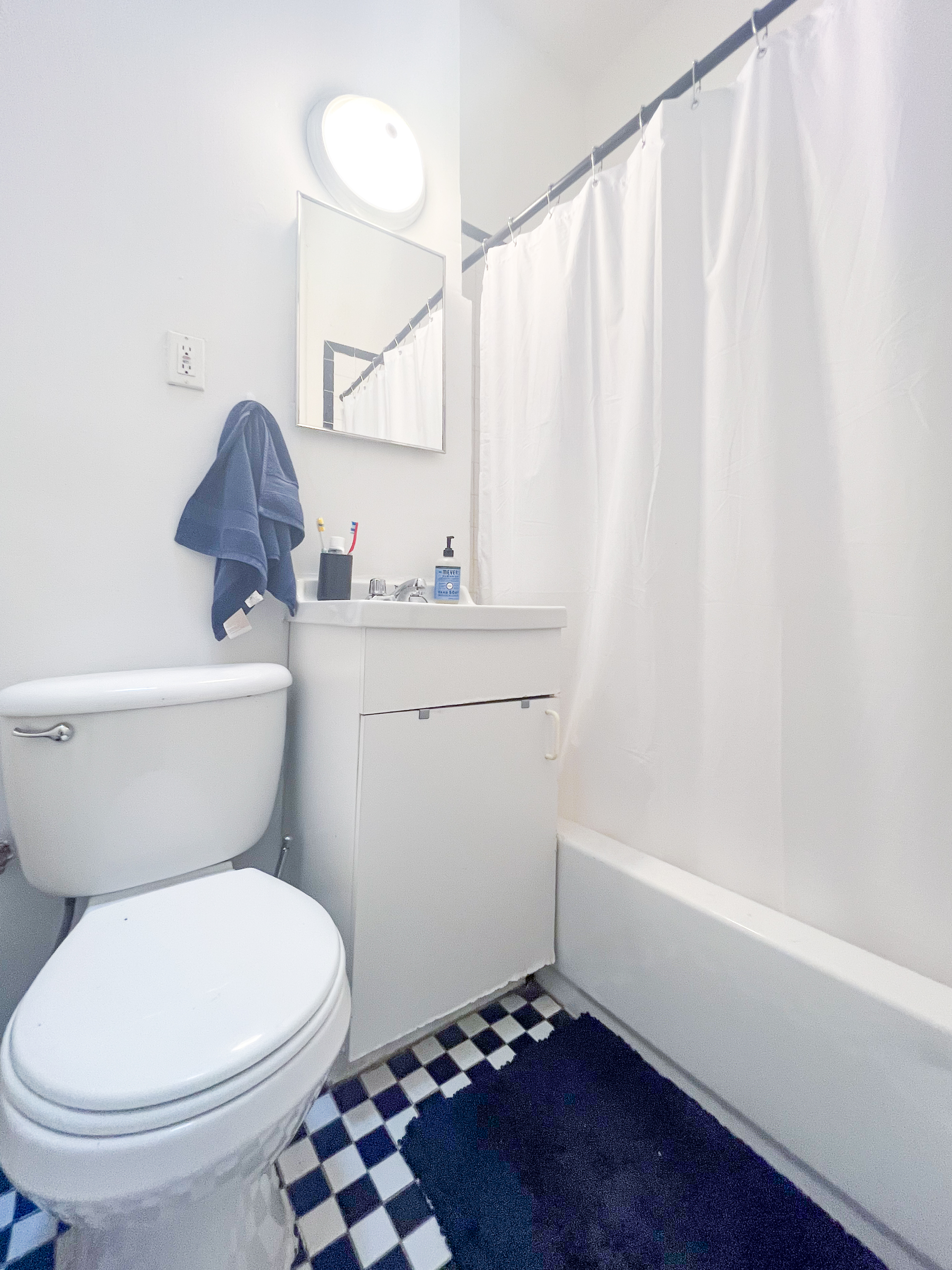 320 West 20th Street, Unit 14 Manhattan, NY 10011 - Photo 5 of 13 a bathroom with a toilet a sink and a shower