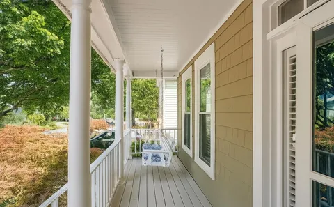 a view of a balcony with wooden floor