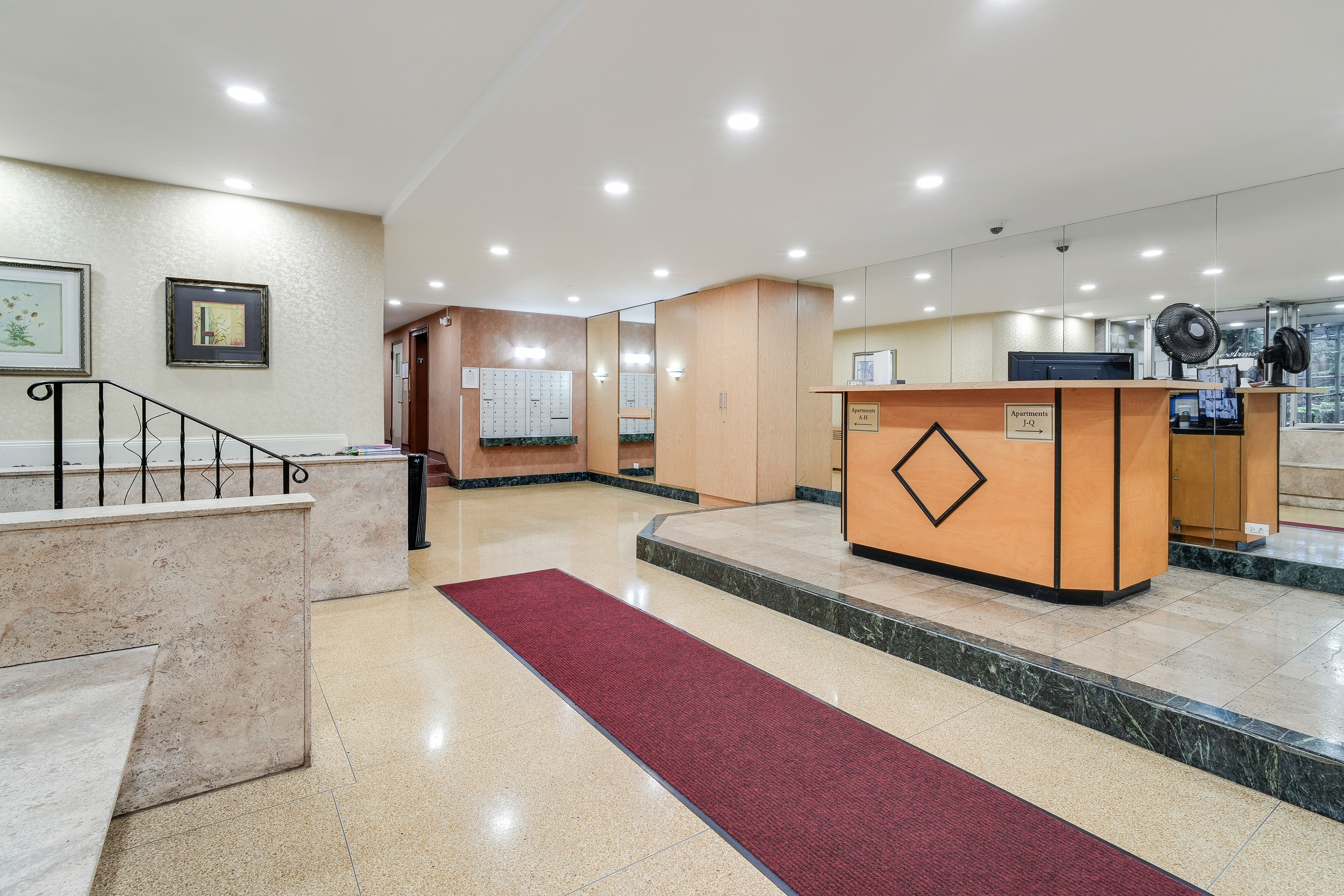 9801 Shore Road, Unit BB Brooklyn, NY 11209 - Photo 10 of 13 a large kitchen with stainless steel appliances kitchen island granite countertop a large kitchen island a stove and a sink