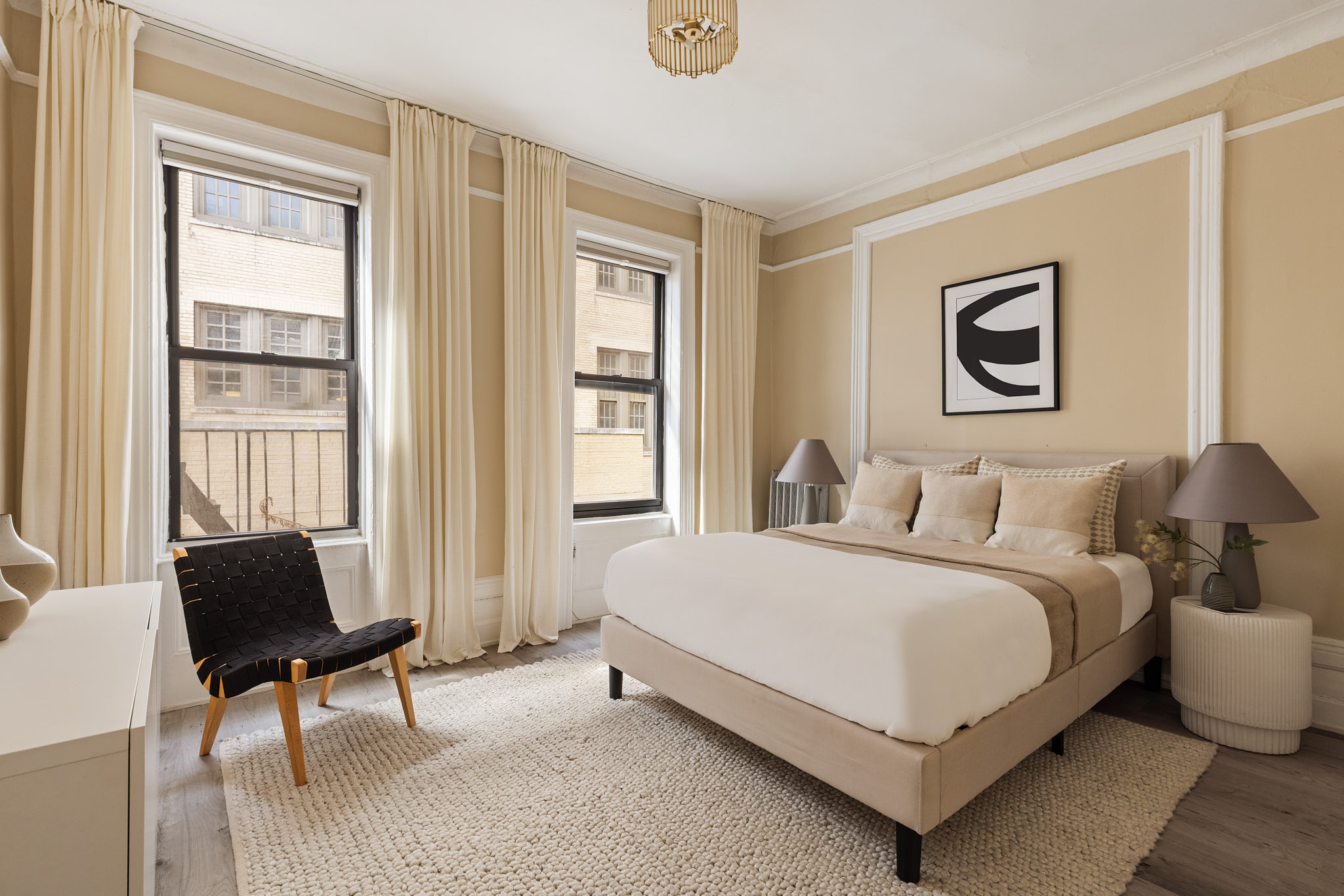 340 West 19th Street, Unit 20 Manhattan, NY 10011 - Photo 4 of 8 a bedroom with a bed and a window