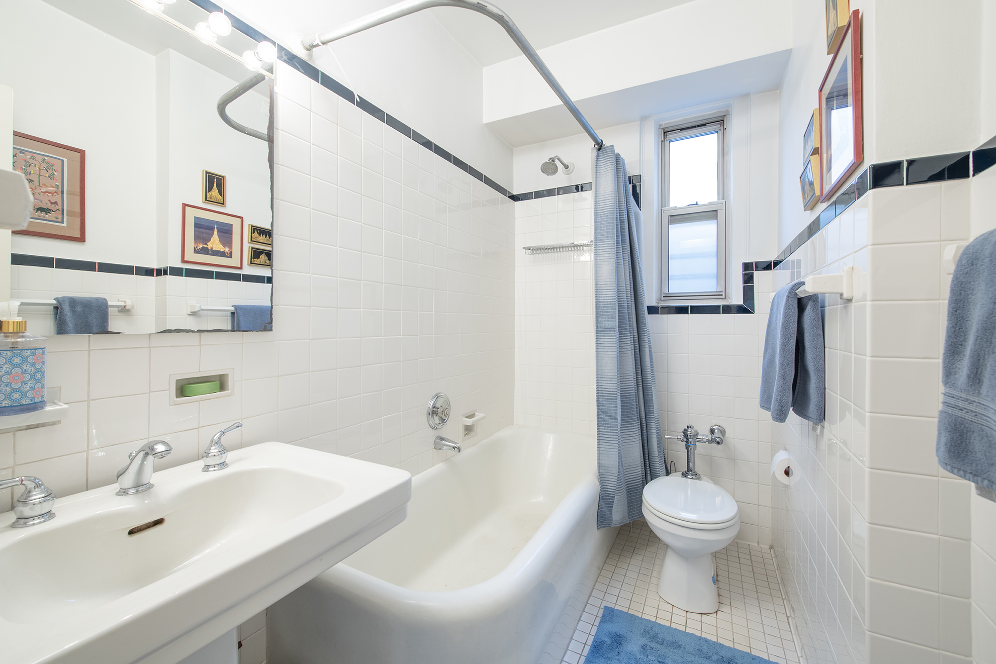 12 West 96th Street, Unit 16A Manhattan, NY 10025 - Photo 9 of 13 a bathroom with a sink toilet and shower