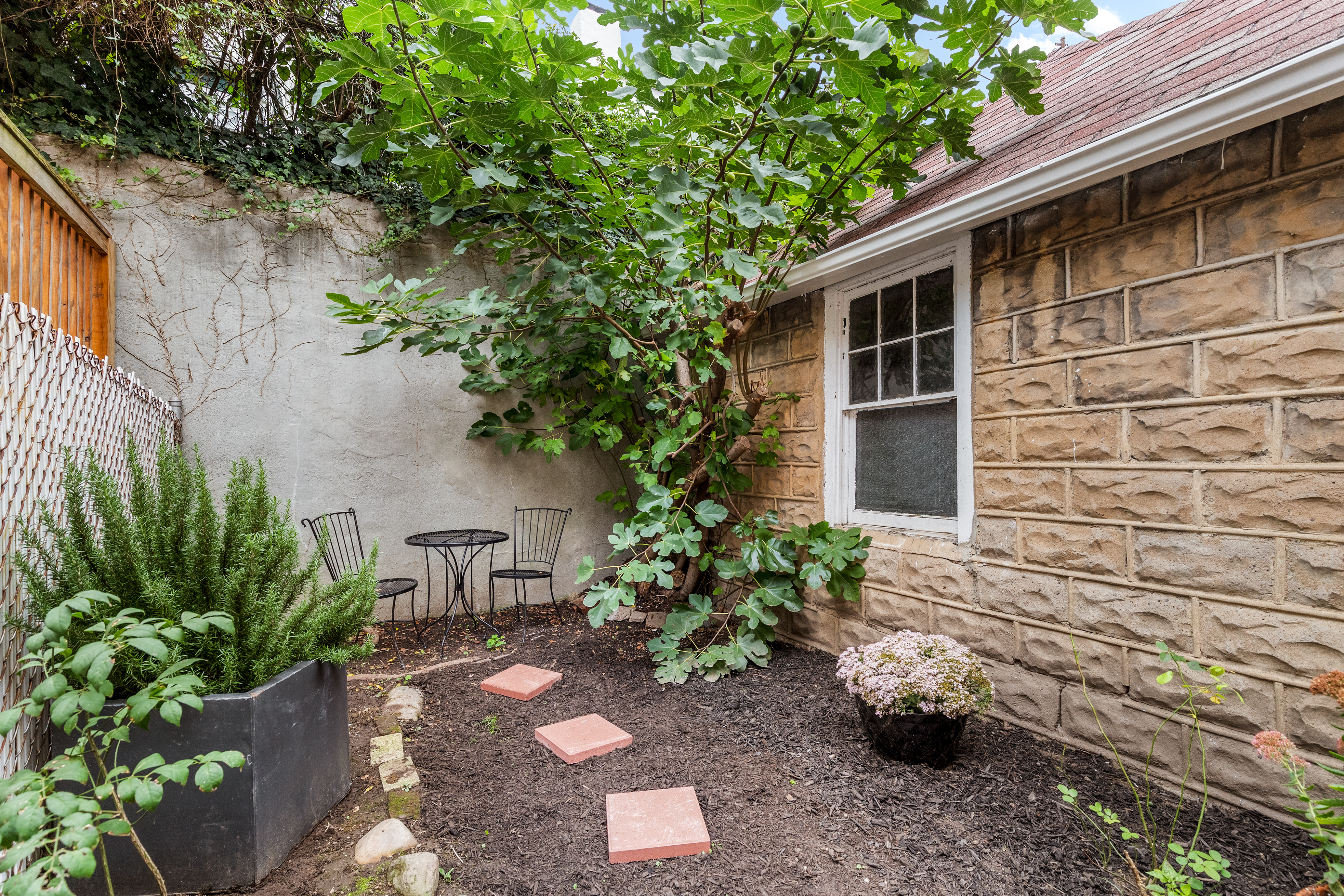 181 Terrace Place Brooklyn, NY 11218 - Photo 3 of 22 a backyard of a house with outdoor seating
