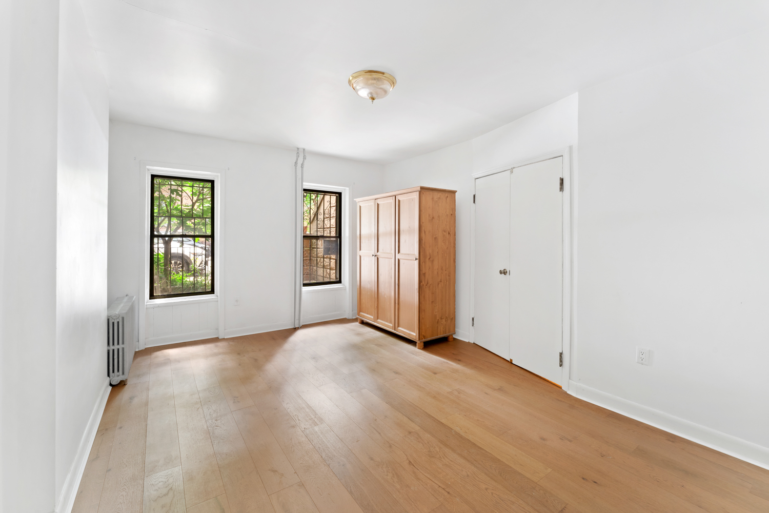 281 6th Street, Unit 1 Brooklyn, NY 11215 - Photo 6 of 7 an empty room with windows and closet