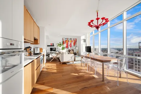a very nice looking living room with dining room and flat screen tv