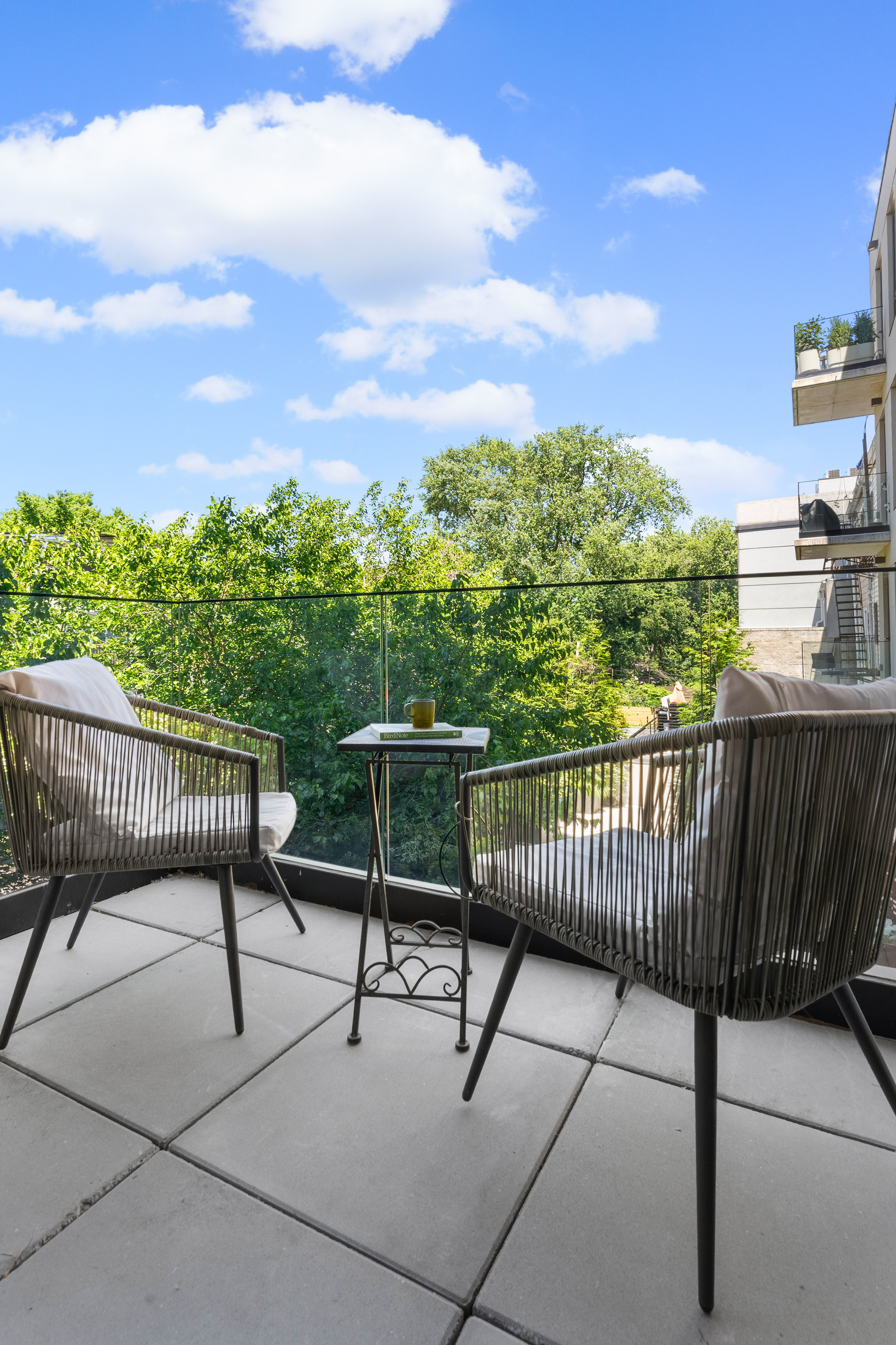 435 Tompkins Avenue, Unit 303 Brooklyn, NY 11216 - Photo 6 of 10 a view of a chairs and table in patio