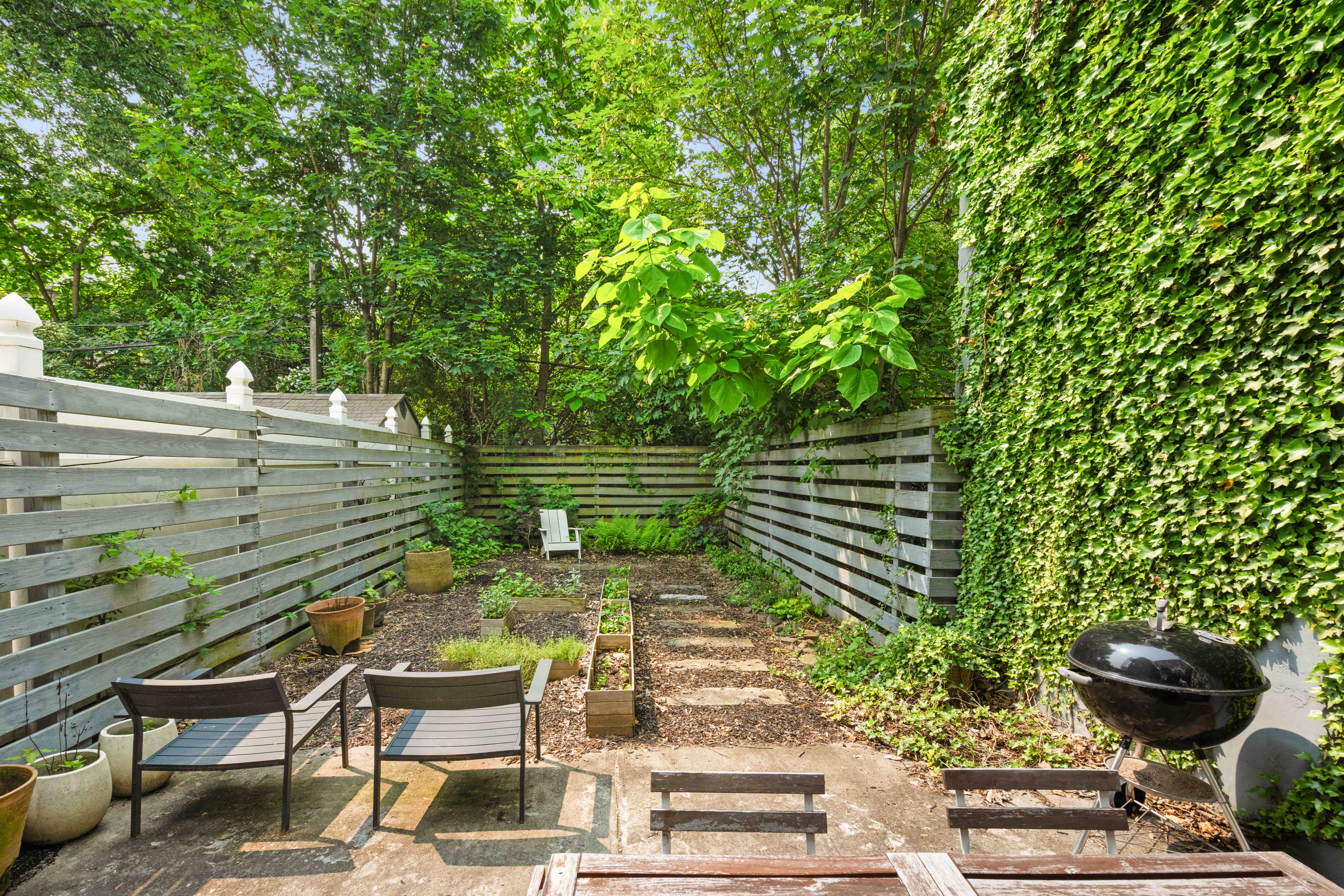 748 Madison Street, Unit 1 Brooklyn, NY 11221 - Photo 8 of 10 a view of a chairs and table in the backyard