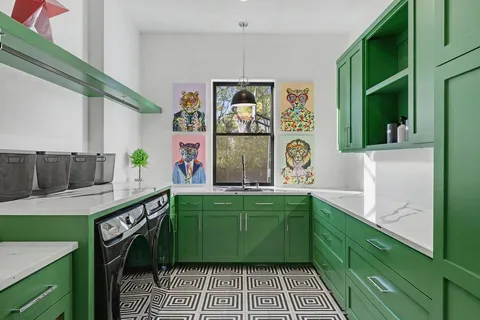 a kitchen with a sink and cabinets