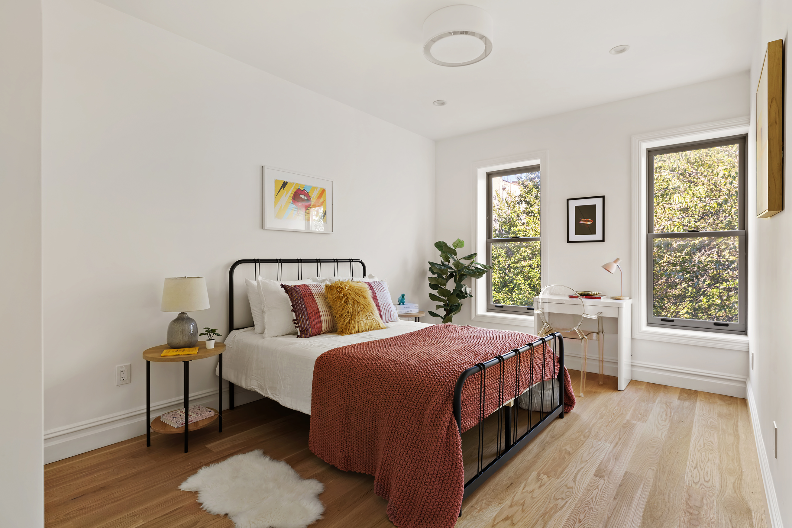 1433 Dean Street Brooklyn, NY 11213 - Photo 12 of 18 a bedroom with a bed wooden floor and window