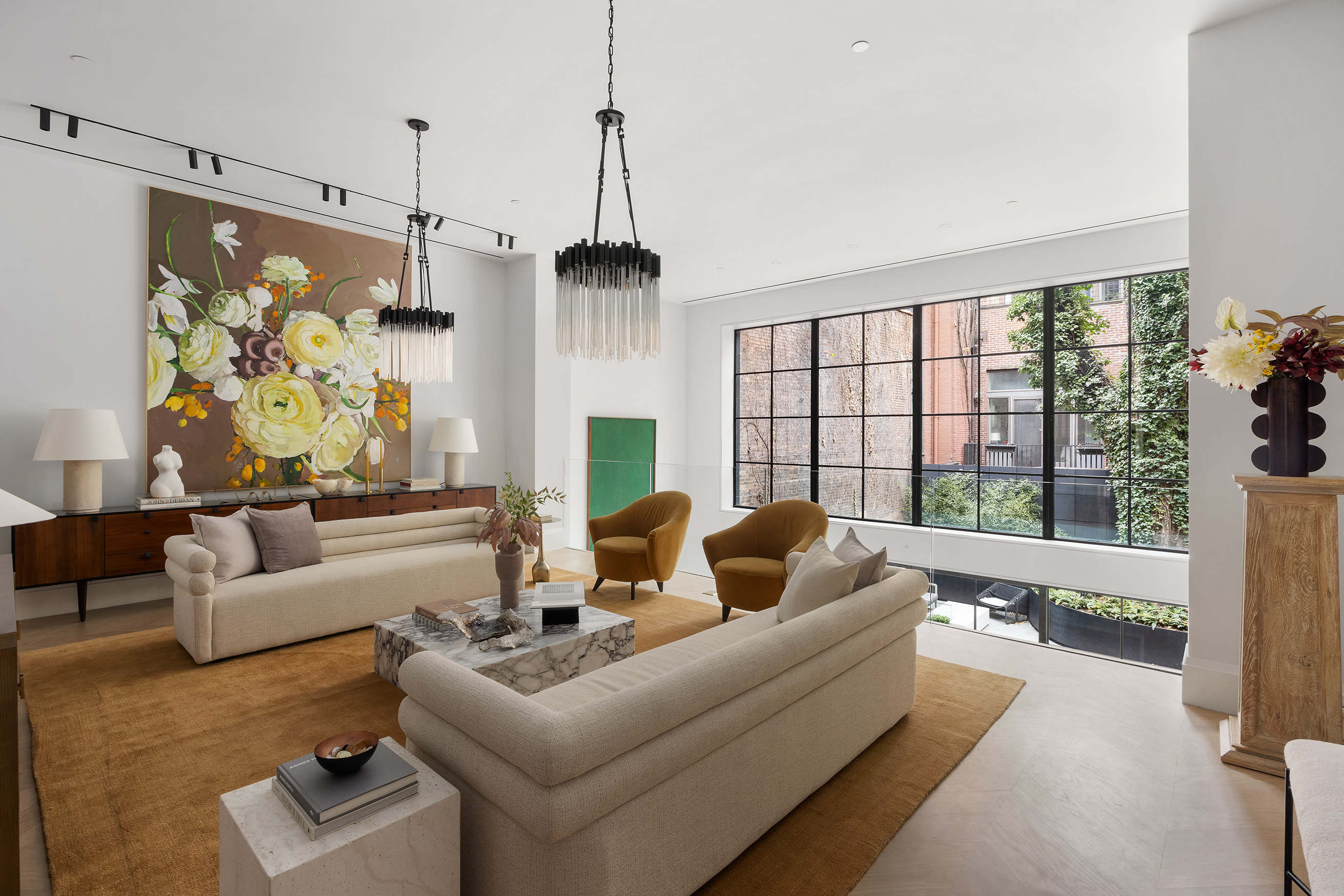 17 East 9th Street Manhattan, NY 10003 - Photo 3 of 32 a living room with furniture and a large window